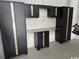 Garage with modern storage cabinets and countertop work space at 172 Enclave Pl., Pawleys Island, SC 29585