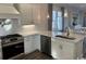 Well-equipped kitchen with modern appliances, ample counter space, and eat-in dining area at 172 Enclave Pl., Pawleys Island, SC 29585