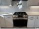 Modern kitchen with stainless steel appliances, gas range, and white subway tile backsplash at 172 Enclave Pl., Pawleys Island, SC 29585