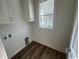 Cozy laundry room featuring wood flooring and window at 172 Enclave Pl., Pawleys Island, SC 29585