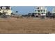 Marsh view featuring dunes with single-Gathering homes in the background at 172 Enclave Pl., Pawleys Island, SC 29585