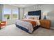Comfortable bedroom with scenic views, complemented by stylish decor and a calming color scheme at 2027 Copper Creek Loop, Longs, SC 29568