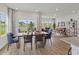 Inviting dining area with views of the water, seamlessly connected to the open living spaces at 2027 Copper Creek Loop, Longs, SC 29568