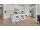 Stylish kitchen featuring stainless steel appliances, a granite island with barstool seating, and ample cabinetry at 2027 Copper Creek Loop, Longs, SC 29568