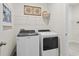 Convenient laundry room featuring modern appliances and ample shelving for storage at 2027 Copper Creek Loop, Longs, SC 29568