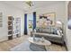 Cozy living area with a comfortable sofa, decorative shelving, and natural light from a window at 2027 Copper Creek Loop, Longs, SC 29568