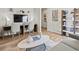 Well-designed living space with work area, sleek shelving, and modern decor at 2027 Copper Creek Loop, Longs, SC 29568
