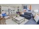 Open floor plan showcasing the modern kitchen and a comfortable living area with stylish furniture at 2027 Copper Creek Loop, Longs, SC 29568