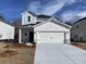 Charming two-story home with a well-manicured front yard and a spacious two-car garage at 2035 Copper Creek Loop, Longs, SC 29568