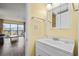 Well-lit bathroom featuring a white vanity with storage and a mirror at 210 75Th Ave N # 4032, Myrtle Beach, SC 29572