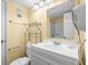Cozy bathroom with a white vanity, toilet, and mirror over the sink at 210 75Th Ave N # 4032, Myrtle Beach, SC 29572
