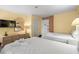 Comfortable bedroom with two beds and a dresser with a TV for lodging at 210 75Th Ave N # 4032, Myrtle Beach, SC 29572