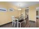 Charming dining area with seating and access to the kitchen and bedroom at 210 75Th Ave N # 4032, Myrtle Beach, SC 29572