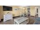 Living room with coffee table, dining table, and kitchen entrance at 210 75Th Ave N # 4032, Myrtle Beach, SC 29572