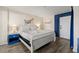 Bright bedroom features white bedding, blue nightstand, and calming artwork at 210 75Th Ave N # 4033, Myrtle Beach, SC 29572
