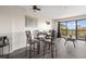 Well-lit dining area with a glass table and chairs, with access to the balcony, enhancing the condo's appeal at 210 75Th Ave N # 4033, Myrtle Beach, SC 29572