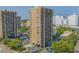 Exterior view of a high-rise condo building with parking, pool, and balcony views at 210 75Th Ave N # 4033, Myrtle Beach, SC 29572