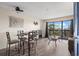 Inviting living area with a glass table, balcony access, modern decor, and neutral color palette, perfect for relaxation at 210 75Th Ave N # 4033, Myrtle Beach, SC 29572