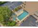 Aerial view of the pool area with lounge chairs and lush landscaping at 210 75Th Ave N # 4033, Myrtle Beach, SC 29572