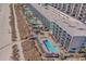 Expansive aerial view of oceanfront resort featuring multiple pools, beach access, and various amenities with sunny skies at 2301 S Ocean Blvd. # 825, Myrtle Beach, SC 29577