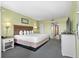 Relaxing bedroom with a king-size bed, soft lighting, and a view of the ocean from the doorway at 2301 S Ocean Blvd. # 825, Myrtle Beach, SC 29577