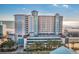 Beautiful light blue and tan exterior of a multi-story beachfront condo building with a parking deck on the lower level at 2301 S Ocean Blvd. # 825, Myrtle Beach, SC 29577