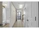 Bright tiled hallway shows a bathroom, kitchen, and the balcony at the end at 2301 S Ocean Blvd. # 825, Myrtle Beach, SC 29577