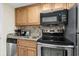 Up close view of the kitchen with granite countertops and stainless steel appliances at 2301 S Ocean Blvd. # 825, Myrtle Beach, SC 29577