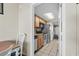 Well-lit galley kitchen features stainless steel appliances and wood cabinets at 2301 S Ocean Blvd. # 825, Myrtle Beach, SC 29577