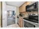 A well-equipped kitchen with stainless steel appliances and a view of the open-concept dining and living area at 2301 S Ocean Blvd. # 825, Myrtle Beach, SC 29577