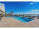 Outdoor pool area showcasing poolside lounge chairs with beautiful ocean views and clear blue skies at 2301 S Ocean Blvd. # 825, Myrtle Beach, SC 29577