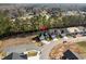 An aerial view showing houses with attached garages in a quiet neighborhood at 2449 Campton Loop, Conway, SC 29527