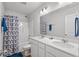 A well-lit bathroom features a double sink vanity and shower-tub combination at 2449 Campton Loop, Conway, SC 29527