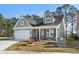 Charming home with a welcoming front porch and well-kept lawn at 2449 Campton Loop, Conway, SC 29527