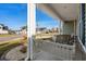 Inviting front porch featuring a porch swing and views of the neighborhood at 2449 Campton Loop, Conway, SC 29527