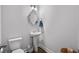 A powder room featuring a stylish pedestal sink and decorative mirror at 2449 Campton Loop, Conway, SC 29527