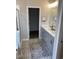 Modern bathroom with double vanities, and designer tile flooring, and a walk-in closet at 2501 Brescia St., Myrtle Beach, SC 29579
