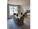 Elegant dining room with a chandelier, a large window, and a view into the living area at 2501 Brescia St., Myrtle Beach, SC 29579