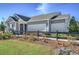 View of a single-story home featuring a two-car garage, well-manicured lawn, and landscaped front yard at 2501 Brescia St., Myrtle Beach, SC 29579