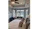 Bright main bedroom with comfortable seating and a view overlooking a pond at 2501 Brescia St., Myrtle Beach, SC 29579