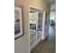 Stylish home office with glass French doors leading to a brightly lit living area at 2501 Brescia St., Myrtle Beach, SC 29579