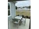 Outdoor patio with a wooden table and chairs, offering a cozy space for relaxation at 2501 Brescia St., Myrtle Beach, SC 29579