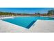 Sparkling community pool surrounded by lounge chairs and a lush landscape at 2501 Brescia St., Myrtle Beach, SC 29579