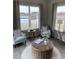 Comfortable sunroom with modern decor, pond views, and lots of natural light at 2501 Brescia St., Myrtle Beach, SC 29579