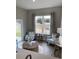 Cozy sunroom featuring comfortable seating, views of a pond, and stylish decor at 2501 Brescia St., Myrtle Beach, SC 29579