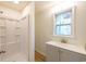 Bright bathroom featuring a shower, a window and a single sink vanity at 2505 Redwood St., Georgetown, SC 29440