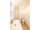 Well-lit bathroom featuring a toilet, a sink and a window at 2505 Redwood St., Georgetown, SC 29440