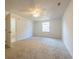 Spacious bedroom featuring neutral carpeting, ceiling fan, and ample natural light at 2505 Redwood St., Georgetown, SC 29440