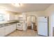 Functional kitchen with white cabinets, a classic stove, and access to other rooms at 2505 Redwood St., Georgetown, SC 29440