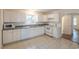 Well-equipped kitchen featuring white cabinetry, appliances, and tile flooring at 2505 Redwood St., Georgetown, SC 29440